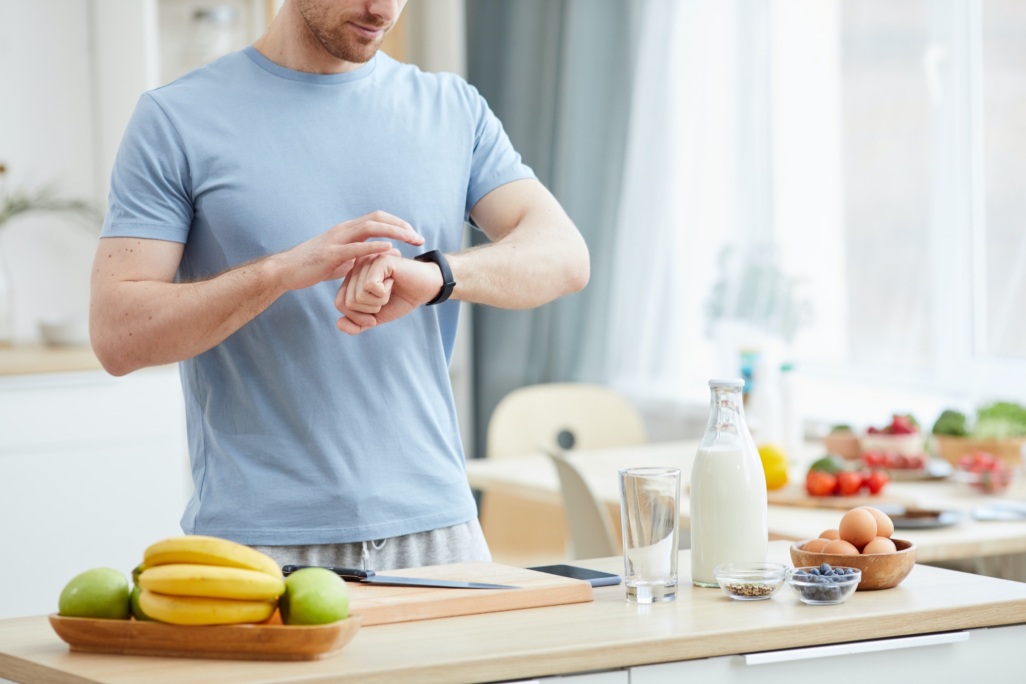 Man eating breakfast by the hour