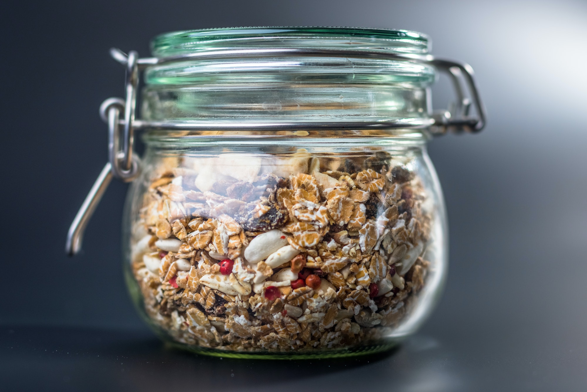 Granola with nuts and seeds in glass jar