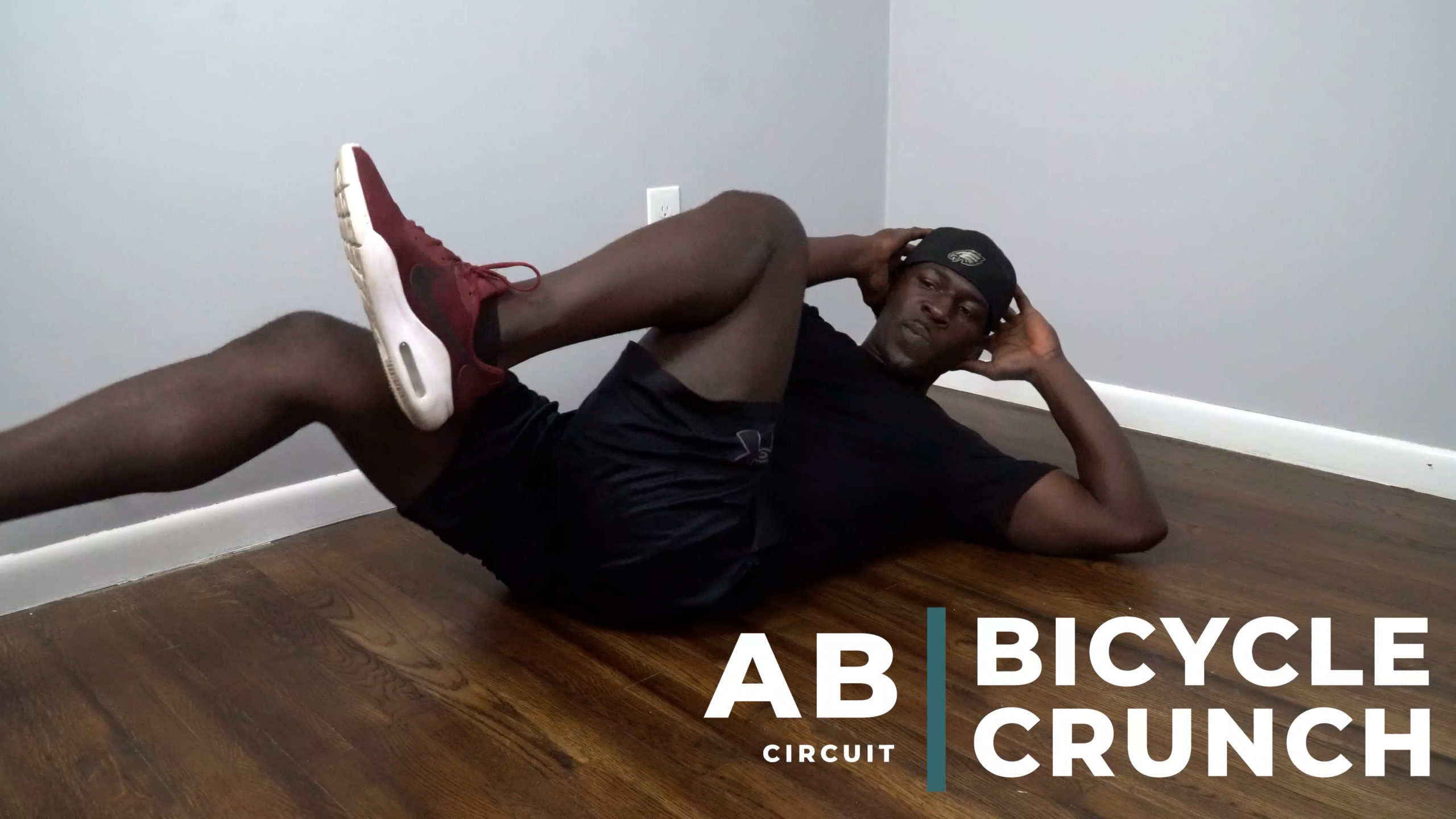 image of man doing abdominal bicycle crunch exercise at home