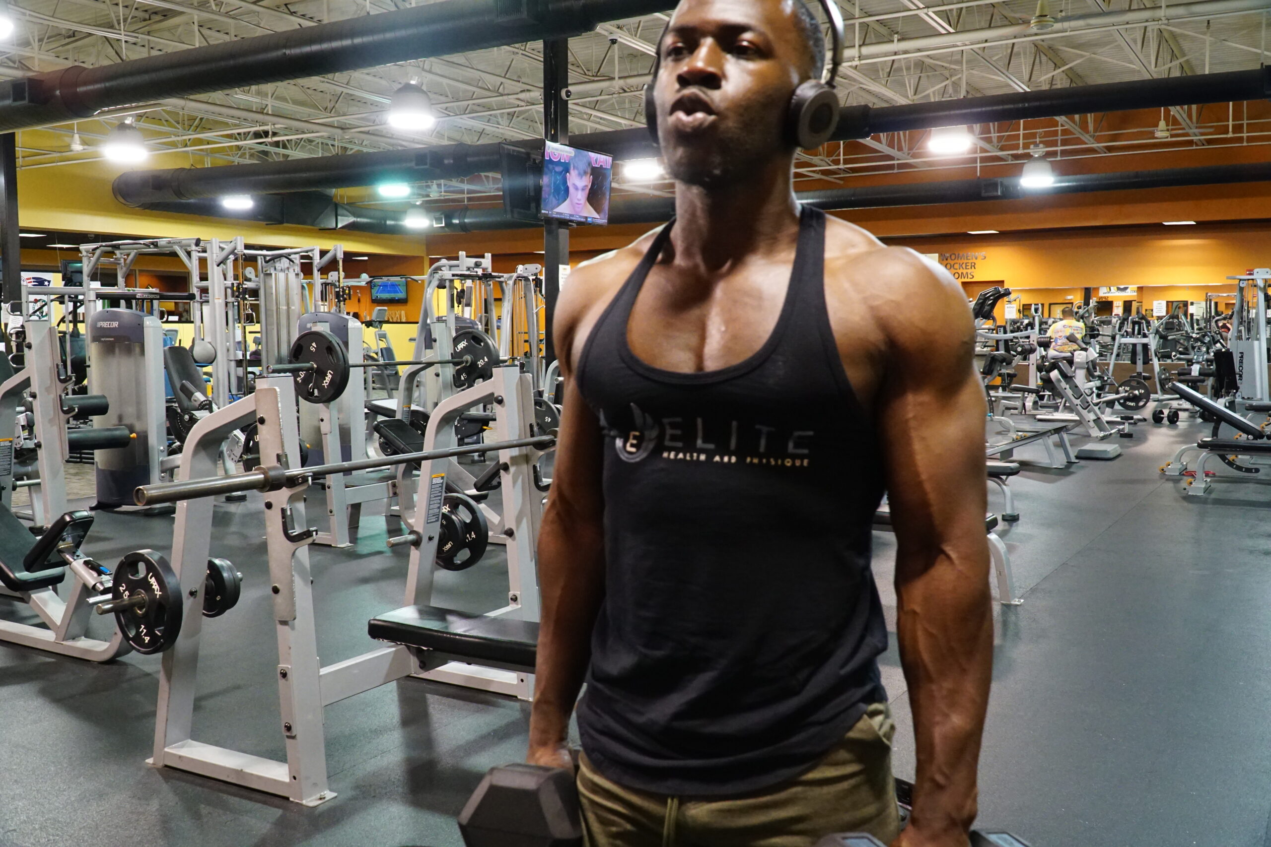 man in mirror after biggest biceps workout